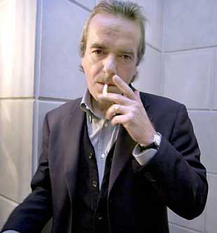 Martin Amis smokes a cigarette