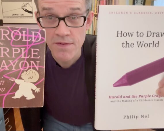 Phil Nel holds up 2 books: Harold and the Purple Crayon and How to Draw the World